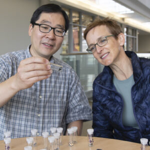 Future Energy Systems Investigators Arthur Mar and Jillian Buriak with sample solar cells.